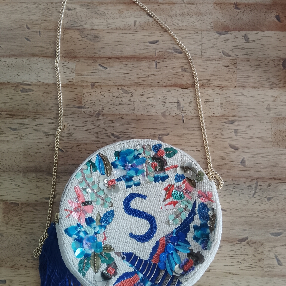 Anthropologie White Beaded Floral Round Crossbody with Blue Tassel